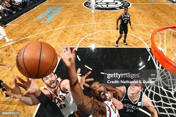 Kevin Love and Tristan Thompson of the Cleveland Cavaliers jump for the rebound against the Brooklyn Nets on October 25, 2017 at Barclays Center in...