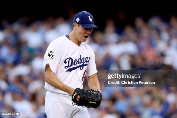 Rich Hill of the Los Angeles Dodgers reacts after pitching the first inning against the Houston Astros in game two of the 2017 World Series at Dodger...