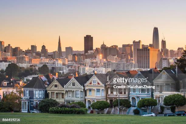alamo square and painted ladies with san francisco skyline - dawn skyline stock pictures, royalty-free photos & images
