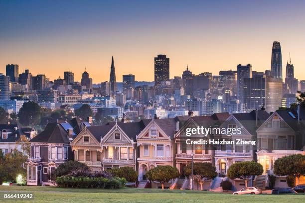 alamo square and painted ladies with san francisco skyline - skyline san francisco stock pictures, royalty-free photos & images