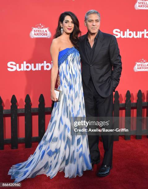 Director George Clooney and wife Amal Clooney arrive at the premiere of Paramount Pictures' 'Suburbicon' at Regency Village Theatre on October 22,...