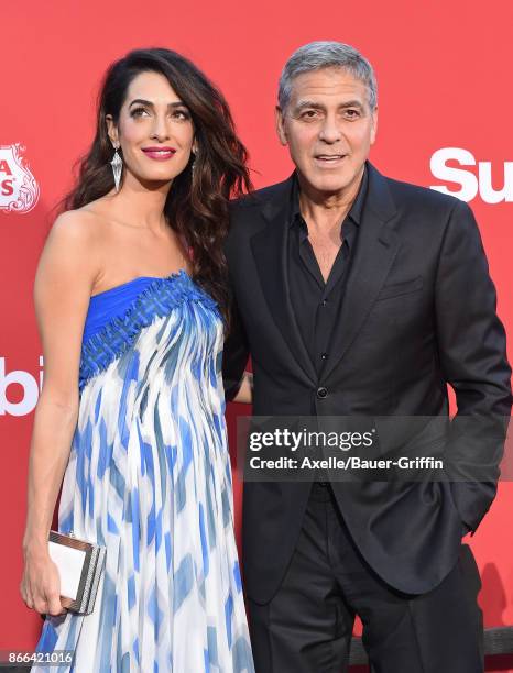 Director George Clooney and wife Amal Clooney arrive at the premiere of Paramount Pictures' 'Suburbicon' at Regency Village Theatre on October 22,...