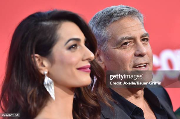 Director George Clooney and wife Amal Clooney arrive at the premiere of Paramount Pictures' 'Suburbicon' at Regency Village Theatre on October 22,...