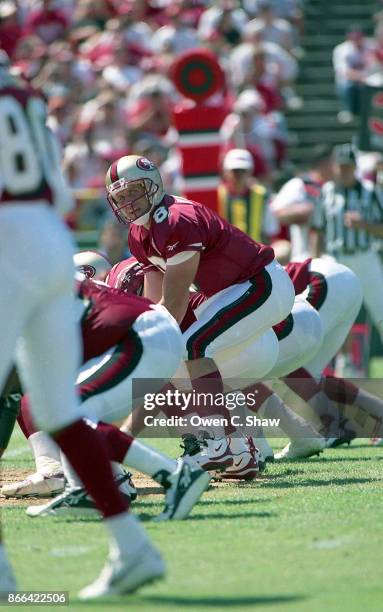 Steve Young of the San Francisco 49ers takes the snap against the New Orleans Saints at Candlestick Park circa 1996 in San Francisco,California.