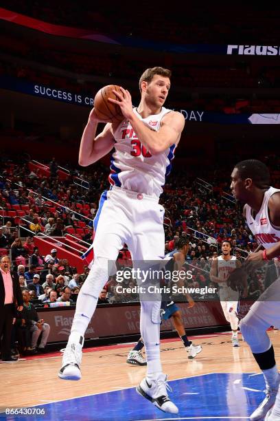 Jon Leuer of the Detroit Pistons handles the ball against the Minnesota Timberwolves on October 25, 2017 at Little Caesars Arena in Detroit,...