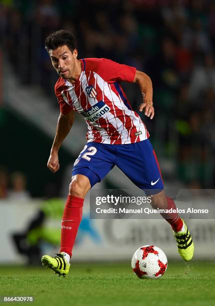 Nico Gaitan of Atletico de Madrid runs with the ball during the Copa del Rey first leg match between Elche CF and Atletico de Madrid at Estadio...