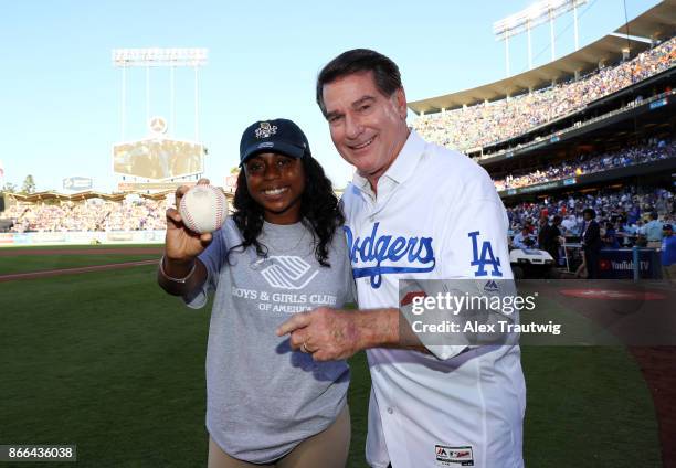 Boys & Girls Clubs of America National Youth of the Year Alanna Moore poses with Steve Garvey before delivering the game ball prior to Game 2 of the...