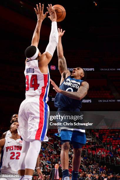 Tobias Harris of the Detroit Pistons and Jeff Teague of the Minnesota Timberwolves vie for the ball during the game on October 25, 2017 at Little...