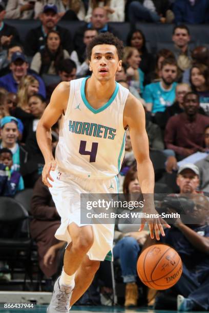 Marcus Paige of the Charlotte Hornets handles the ball against the Denver Nuggets on October 25, 2017 at Spectrum Center in Charlotte, North...