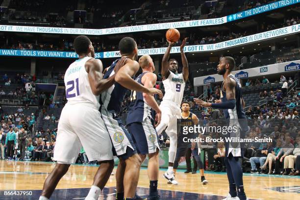 Mangok Mathiang of the Charlotte Hornets shoots the ball against the Denver Nuggets on October 25, 2017 at Spectrum Center in Charlotte, North...