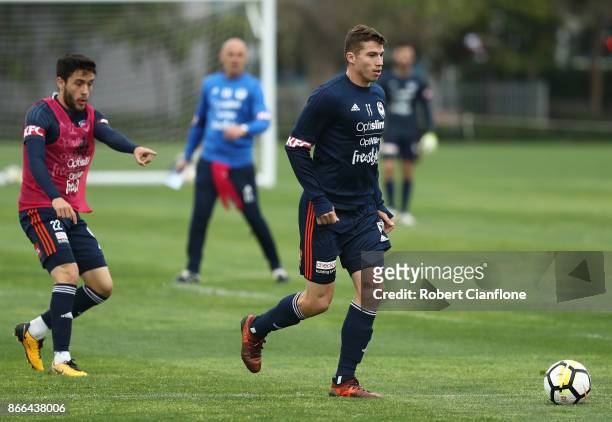 Mitch Austin of the Victory runs with the ball during a Melbourne Victory A-League training session at Gosch's Paddock on October 26, 2017 in...