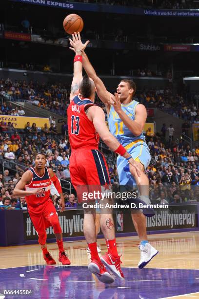 Brook Lopez of the Los Angeles Lakers and Marcin Gortat of the Washington Wizards vie for the ball during the game on October 25, 2017 at STAPLES...