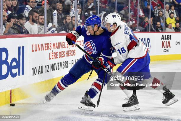 Conor Allen of the Rochester Americans and Martin Reway of the Laval Rocket skate after the puck during the AHL game at Place Bell on October 25,...