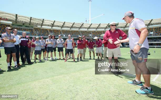 Retiring Gabba Curator Kevin Mitchell is thanked by Andy Bichel and the QLD team during day one of the Sheffield Shield match between Queensland and...