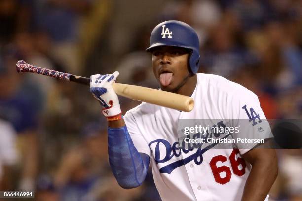 Yasiel Puig of the Los Angeles Dodgers licks his bat during the seventh inning against the Houston Astros in game two of the 2017 World Series at...