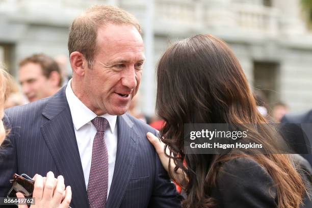 Prime Minister Jacinda Ardern hugs speaks to former Labour leader Andrew Little at Parliament following a swearing-in ceremony at Government House on...