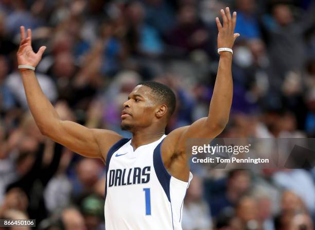 Dennis Smith Jr. #1 of the Dallas Mavericks celebrates after scoring against the Memphis Grizzlies in the second half at American Airlines Center on...