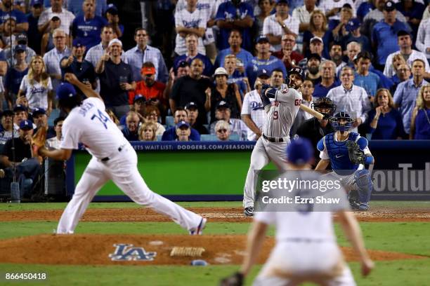 Marwin Gonzalez of the Houston Astros reacts after hitting a solo home run during the ninth inning against the Los Angeles Dodgers in game two of the...