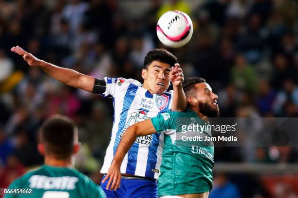 Victor Guzman of Pachuca and Marco Arguelles of Zacatepec fight for the ball during the round of sixteen match between Pachuca and Zacatepec as part...
