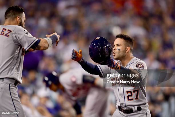 Jose Altuve of the Houston Astros celebrates with Marwin Gonzalez after hitting a solo home run during the tenth inning against the Los Angeles...