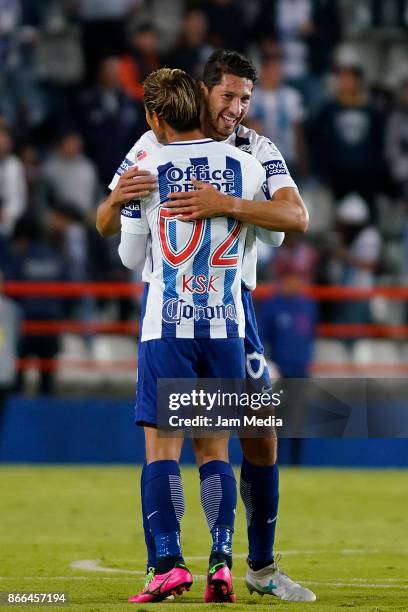 Keisuke Honda of Pachuca celebrates with teammate Omar Gonzalez after scoring the second goal of his team during the round of sixteen match between...