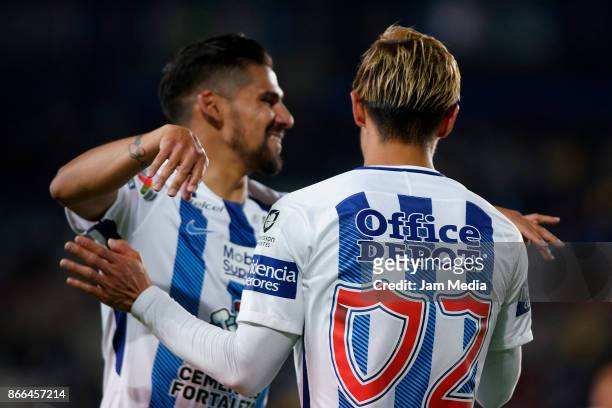 Keisuke Honda of Pachuca celebrates with teammate Franco Jara after scoring the second goal of his team during the round of sixteen match between...