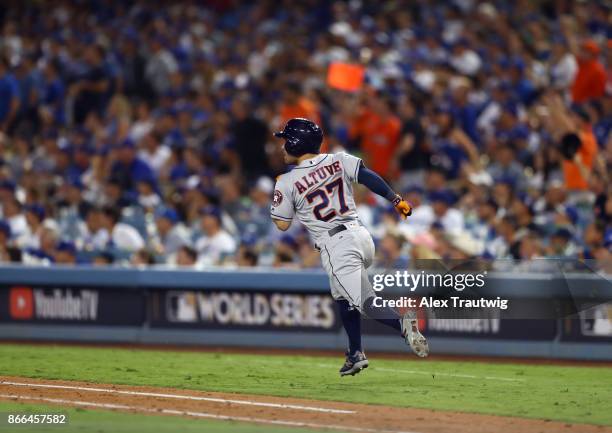 Jose Altuve of the Houston Astros rounds the bases after hitting a solo home run in the 10th inning of Game 2 of the 2017 World Series against the...