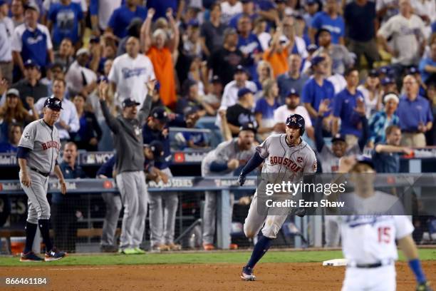 George Springer of the Houston Astros runs the bases after hitting a two-run home run during the eleventh inning against the Los Angeles Dodgers in...