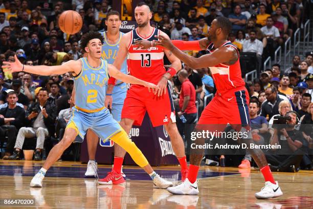 John Wall of the Washington Wizards passes the ball against Lonzo Ball of the Los Angeles Lakers on October 25, 2017 at STAPLES Center in Los...