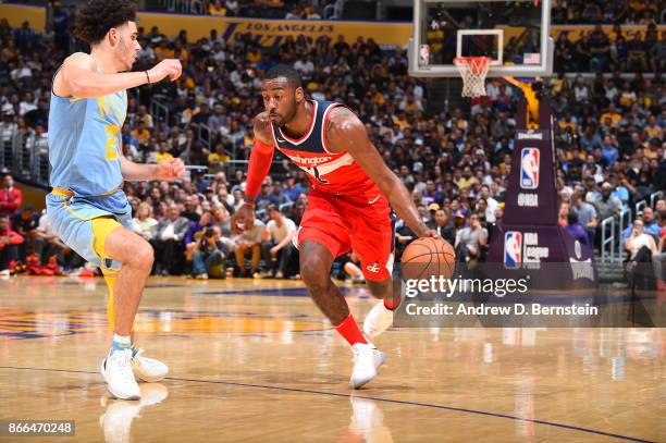 John Wall of the Washington Wizards handles the ball against Lonzo Ball of the Los Angeles Lakers on October 25, 2017 at STAPLES Center in Los...