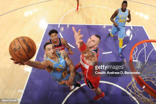Kyle Kuzma of the Los Angeles Lakers drives to the basket against the Washington Wizards on October 25, 2017 at STAPLES Center in Los Angeles,...
