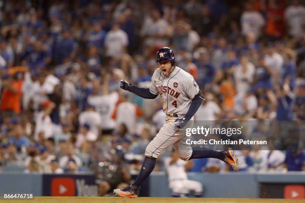 George Springer of the Houston Astros runs the bases after hitting a two-run home run during the eleventh inning against the Los Angeles Dodgers in...