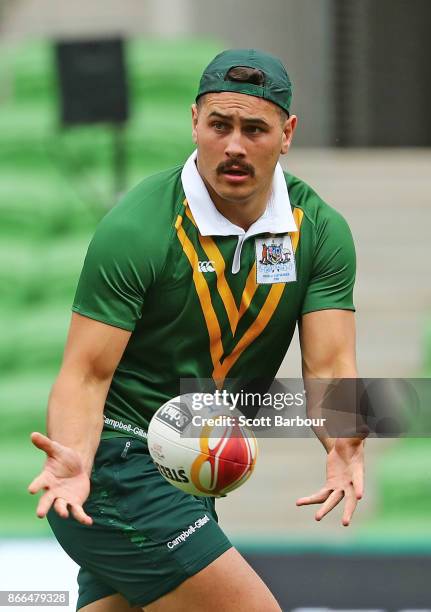 Reagan Campbell-Gillard of the Kangaroos runs with the ball during an Australian Kangaroos training session on October 26, 2017 in Melbourne,...