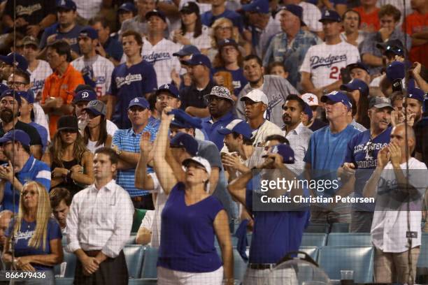 Professional golfer Tiger Woods attends game two of the 2017 World Series between the Houston Astros and the Los Angeles Dodgers at Dodger Stadium on...