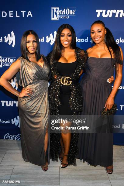 From left, the Real Housewives of Atlanta, Sheree Whitfield, Porsha Williams, Cynthia Bailey, celebrated achievements in the LGBTQ community at the...