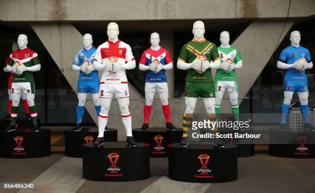 Mannequins wearing the uniforms of the Rugby League World Cup teams sit on display outside of the stadium during an Australian Kangaroos training...
