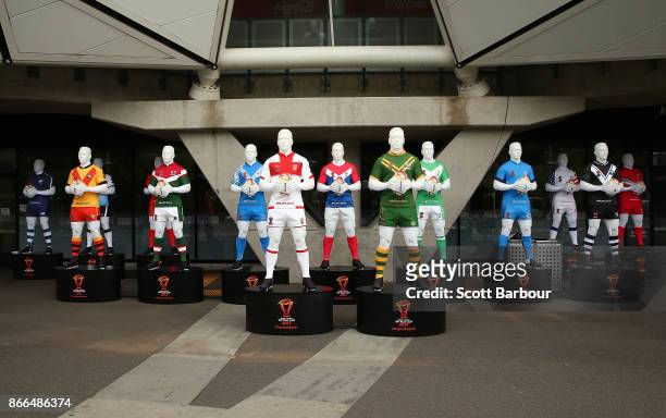 Mannequins wearing the uniforms of the Rugby League World Cup teams sit on display outside of the stadium during an Australian Kangaroos training...