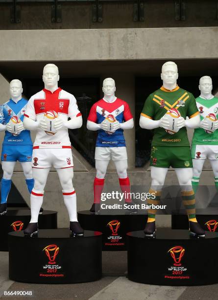 Mannequins wearing the uniforms of the Rugby League World Cup teams sit on display outside of the stadium during an Australian Kangaroos training...