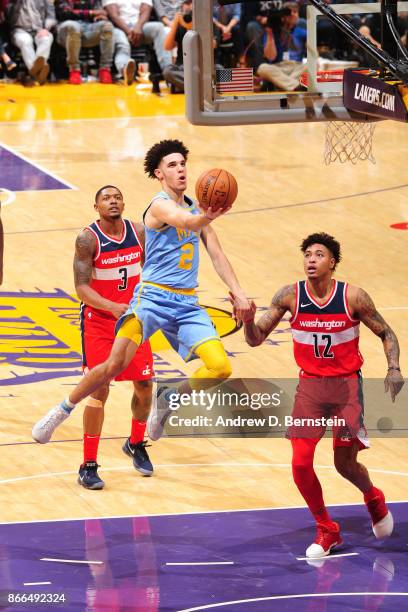 Lonzo Ball of the Los Angeles Lakers drives to the basket against the Washington Wizards on October 25, 2017 at STAPLES Center in Los Angeles,...