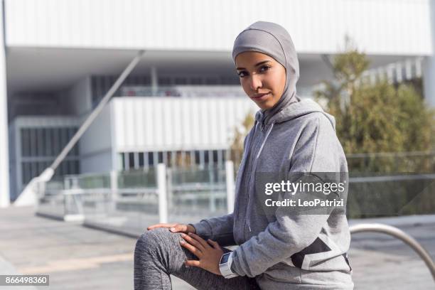 young muslim woman ready to running in the city - moroccan girls stock pictures, royalty-free photos & images