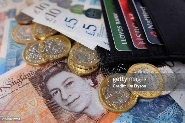 Photo illustration of the new polymer British ten pound note, pictured in a wallet with the new polymer five pound note and the new 12-sided one...