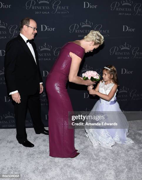 His Serene Highness Prince Albert II of Monaco, Her Serene Highness Princess Charlene of Monaco and flowergirl Sloane Levy arrive at the 2017...