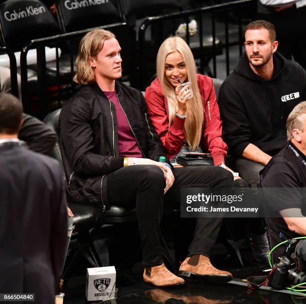 Noah Syndergaard and Alexandra Cooper attend the Cleveland Cavaliers Vs Brooklyn Nets game at Barclays Center on October 25, 2017 in New York City.