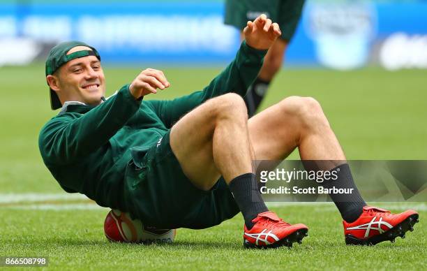 Cooper Cronk of the Kangaroos stretches during an Australian Kangaroos training session on October 26, 2017 in Melbourne, Australia.