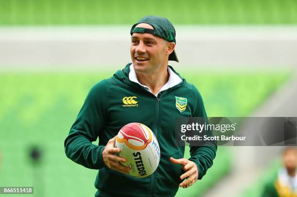 Cooper Cronk of the Kangaroos runs with the ball during an Australian Kangaroos training session on October 26, 2017 in Melbourne, Australia.