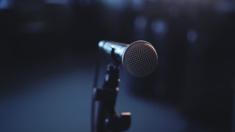 https://media.gettyimages.com/id/866515240/video/pan-left-close-up-microphone-in-room-with-spotlight.jpg?b=1&s=640x640&k=20&c=pjI6y6p6OC4VnsfdTJIZQ4DZejqdfKfqdPBTbPqR24U=