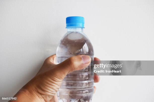 https://media.gettyimages.com/id/866517942/photo/hand-on-plastic-drinking-water.jpg?s=612x612&w=gi&k=20&c=VJdjxz2--x4eBYsO_BHM783a8UNmKOKbvURCIr5h8Zg=