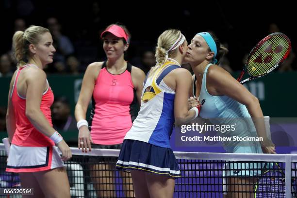 Andrea Hlavackova of Czech Republic and Timea Babos of Hungary celebrate victory in their doubles match against Maria Jose Martinez Sanchez of Spain...