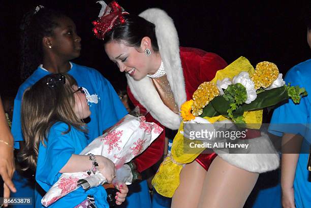 Alena Galan is greeted by Sagan Rose of the World Famous Radio City Rockettes at the Garden of Dreams Foundation talent show at Radio City Music Hall...