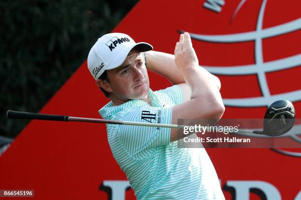 Paul Dunne of Ireland plays his shot from the 18th tee during the first round of the WGC - HSBC Champions at Sheshan International Golf Club on...
